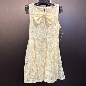 Duchess Lace Overlay, lined,bow-front,keyhole button back,sleeveless flowy dress